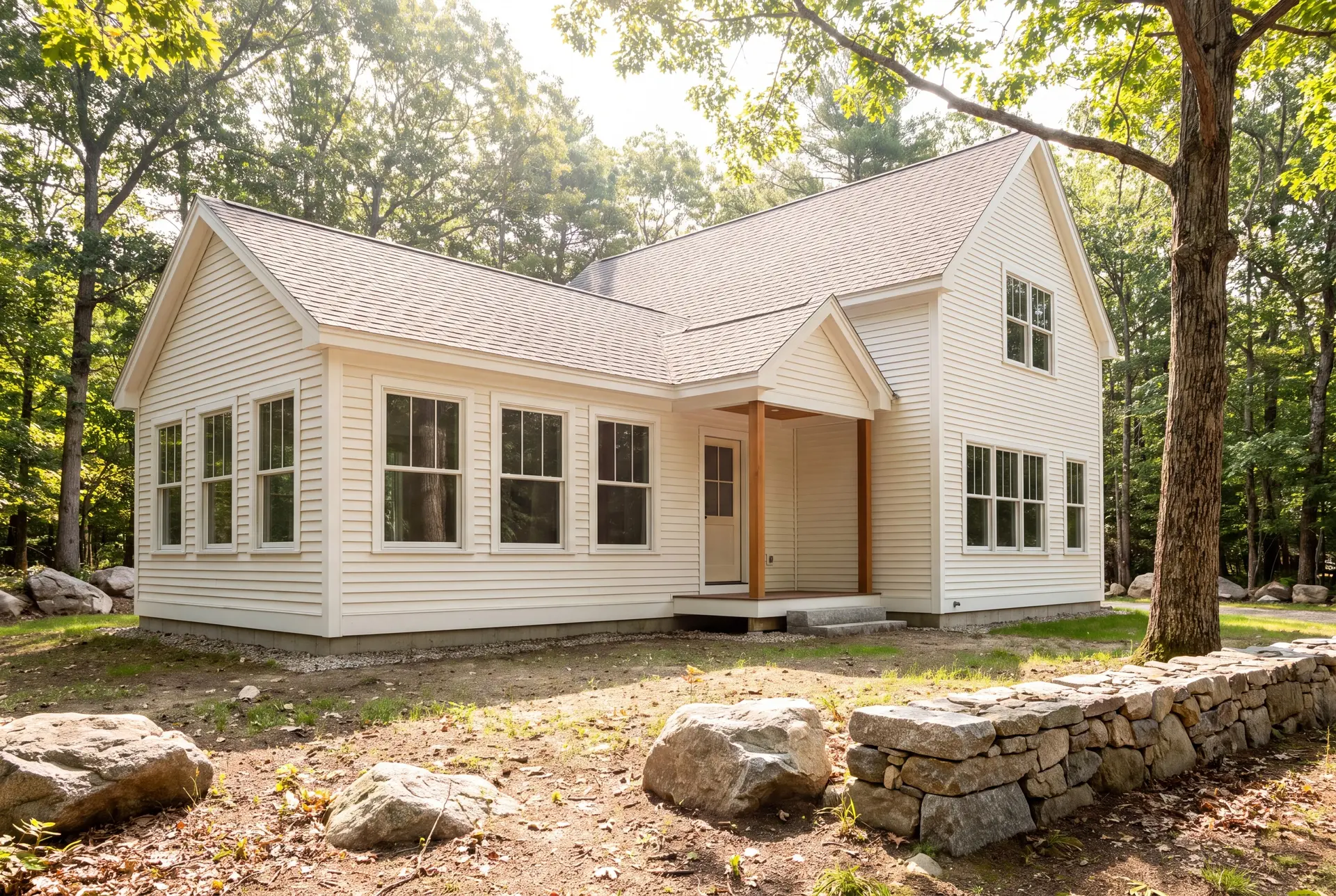 Illustration: A white clapboard house with a new addition, featuring a gabled roof and natural wood porch posts, surrounded by trees and rocks