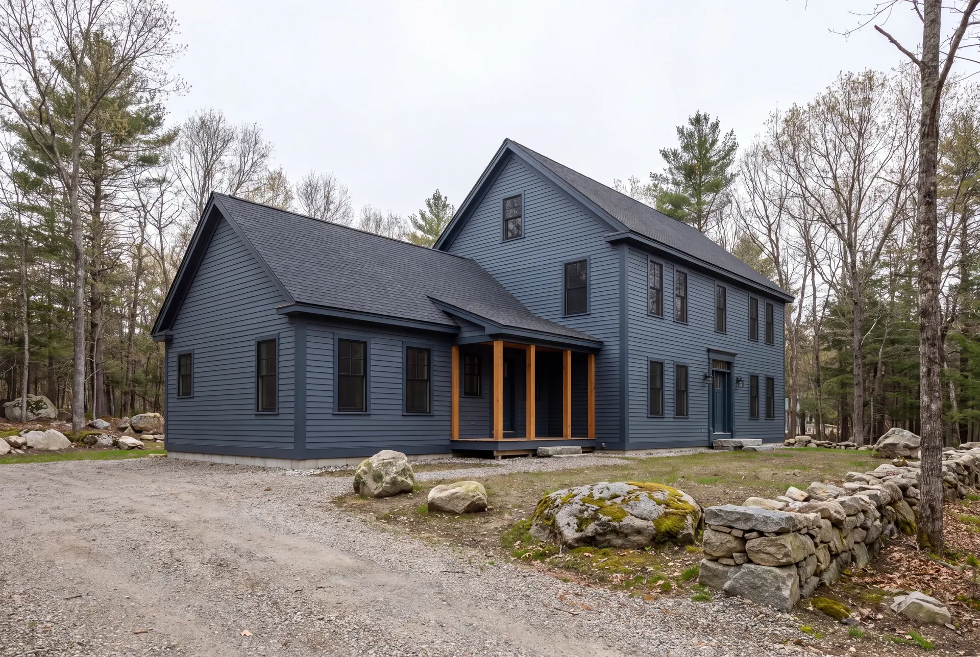 Illustration: A blue house with a new addition and natural timber porch posts, surrounded by trees and rocks