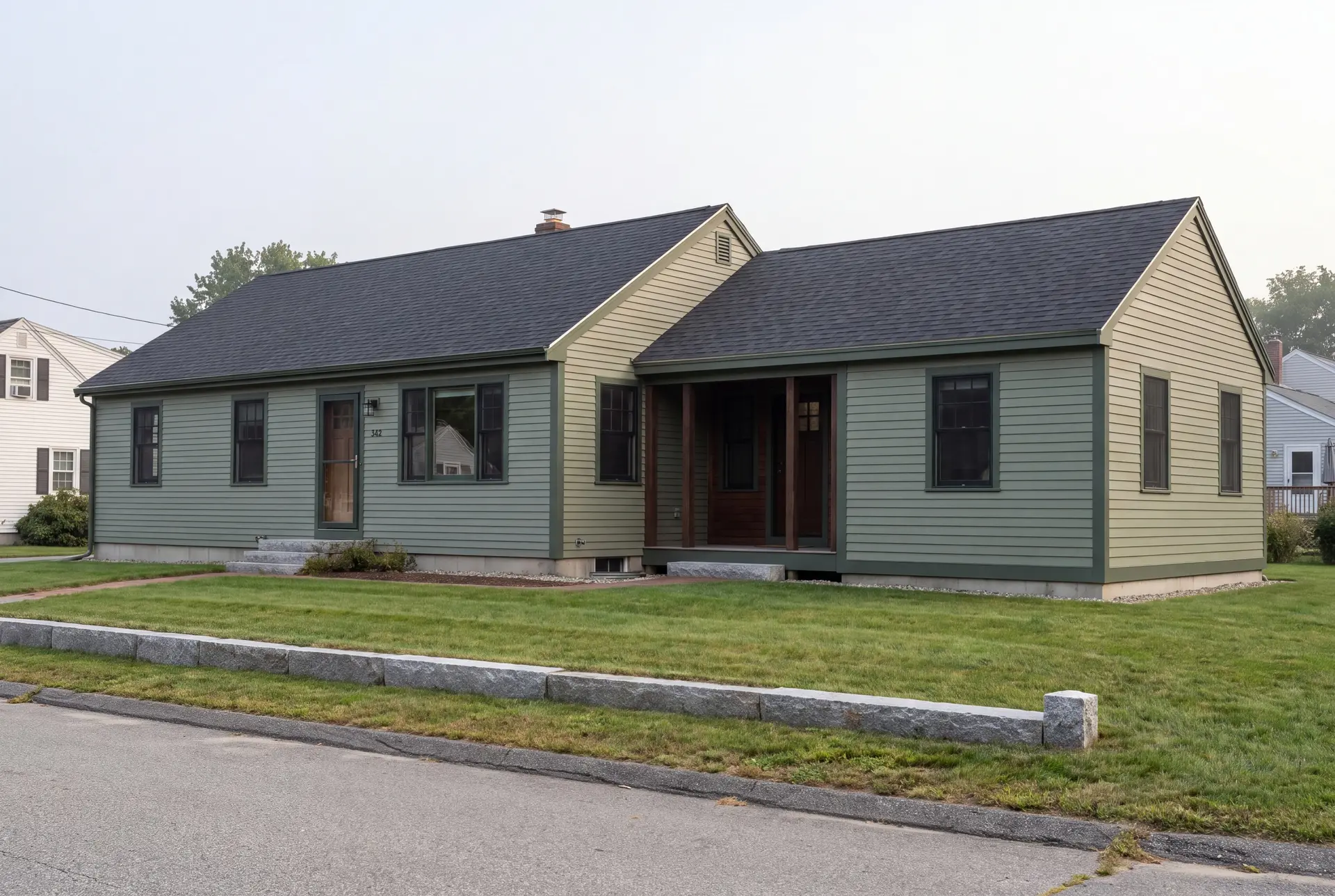 Illustration: A sage green single-story house with a dark roof and a new addition, viewed from a three-quarter exterior perspective