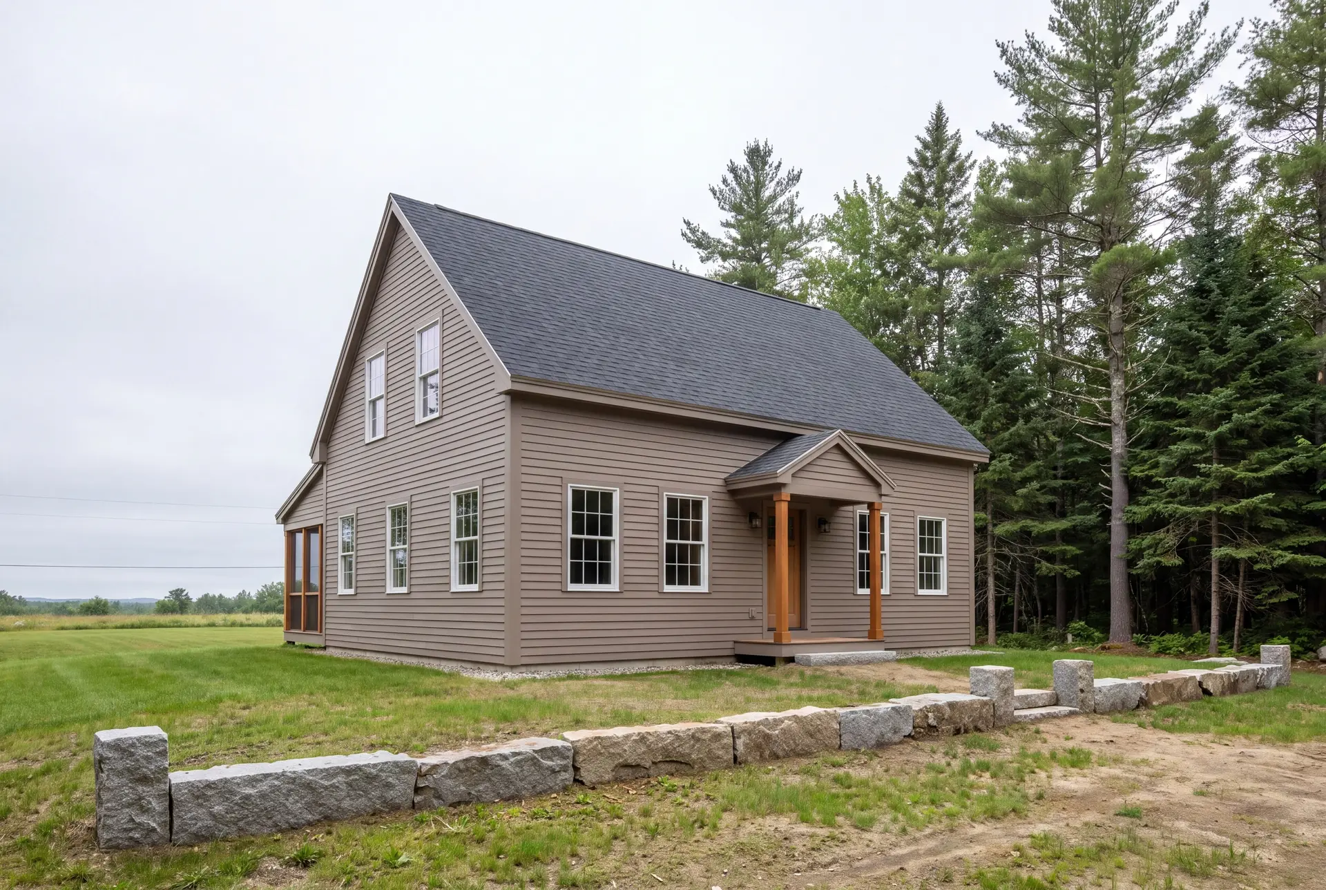 Illustration: A newly built farmhouse with taupe siding and a dark roof, surrounded by grass and trees under a cloudy sky
