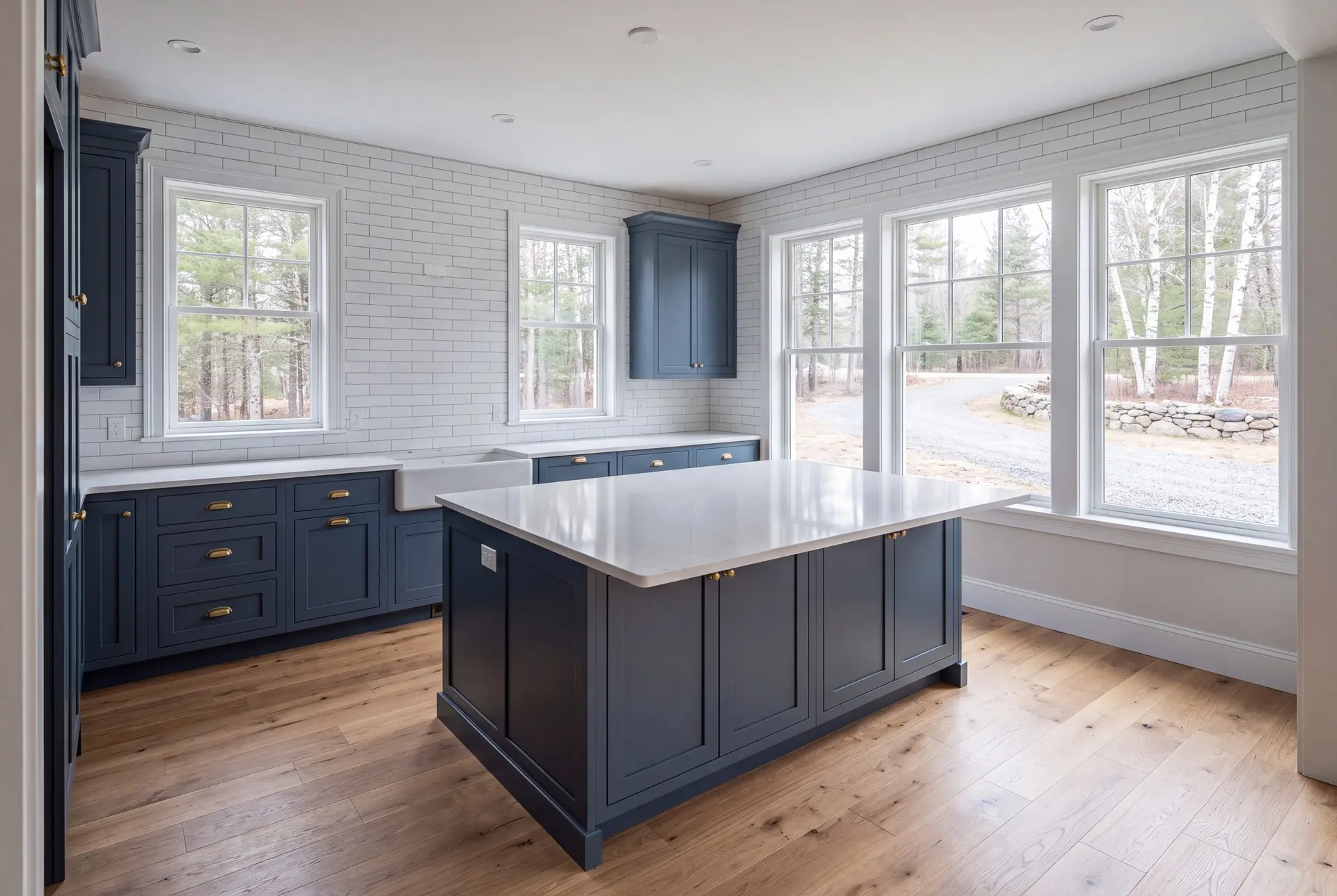 Illustration: A modern kitchen with blue cabinets, a white island, and wood floors, seen from a doorway